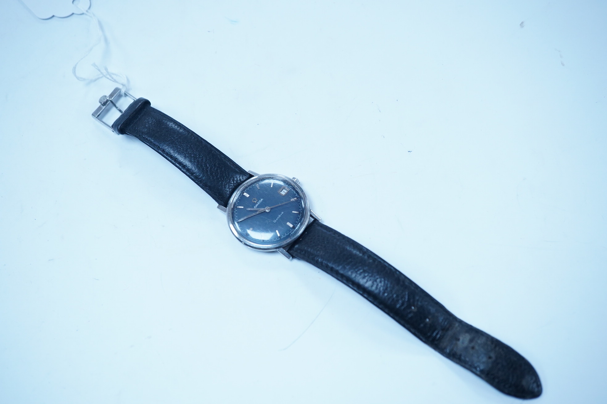 A gentleman's late 1960's stainless steel Omega manual wind wrist watch, with baton numerals and date aperture, movement c.613, case diameter 34mm, on a later associated leather strap. Condition - poor to fair